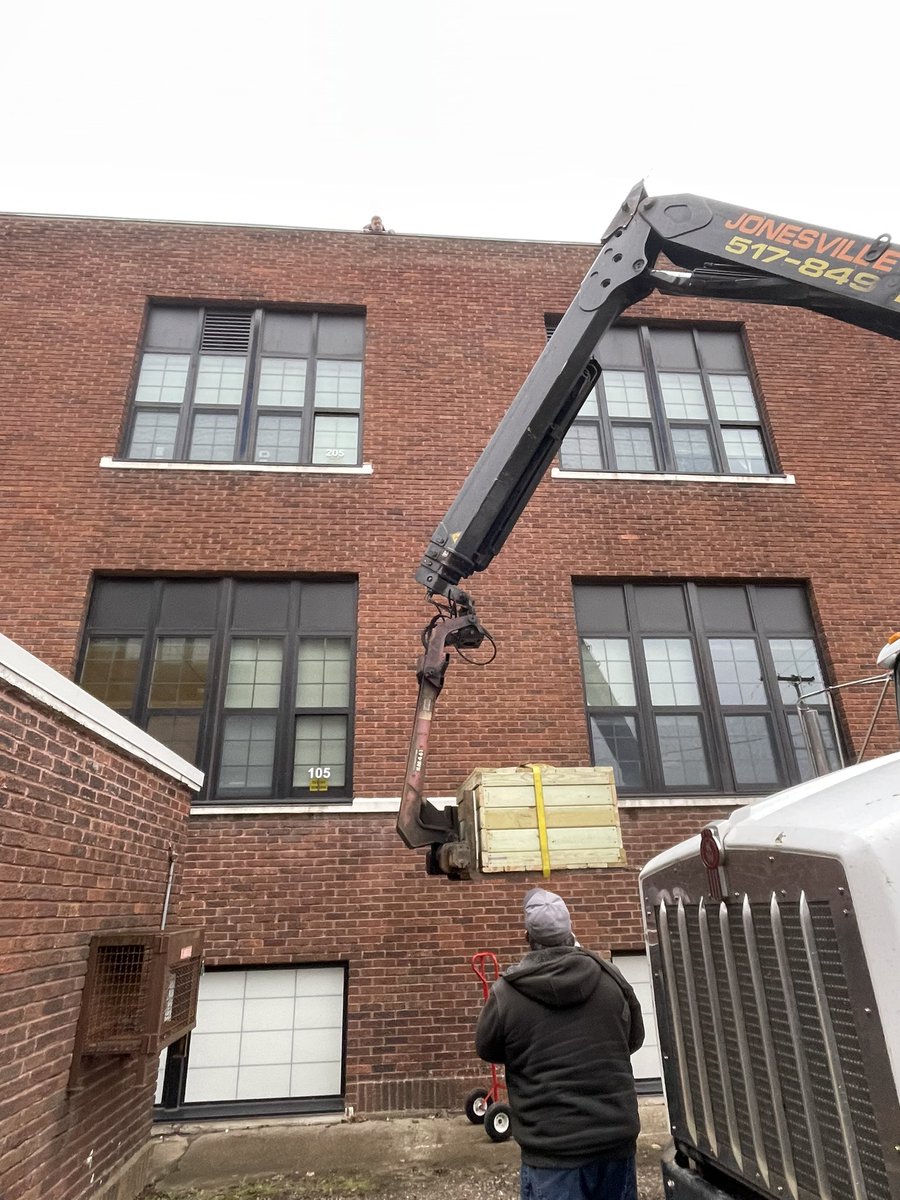 MrsMandrelle's tweet photo. Thanks to our local lumberyard and our janitors, we were able to get our peregrine falcon nesting box on the school roof today. Students modeled after @MSUFWClub box. We hope to get a nesting pair for us to observe. @JonesvilleCS #OneComet https://t.co/8SNjG9R5vJ