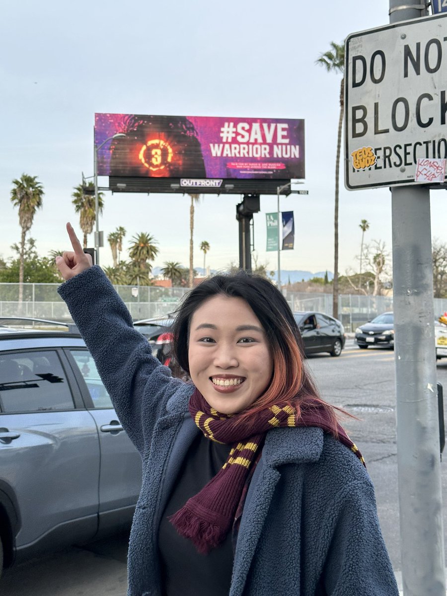 itsmintmindy's tweet photo. @SimonDavisBarry Flew from Singapore to LA and FINALLY saw it, took a pic with it, and cried about it 🥹 #SaveWarriorNun @netflix https://t.co/zjlRQVlNYK