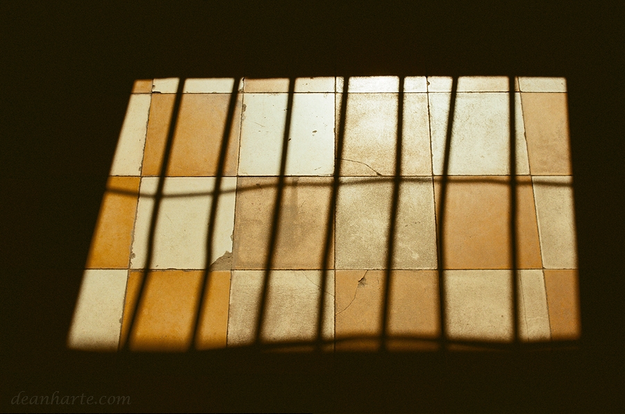 Sunlight casts a shadow on the floor of a prison cell at the former Toul Sleng prison in Phnom Penh.

#kodakektar #KODAK 

#AnaloguePhotography #FilmPhotography #BelieveInFilm #FilmIsNotDead #AnalogCommunity #shotonkodak  #35mmfilm #documentary #History