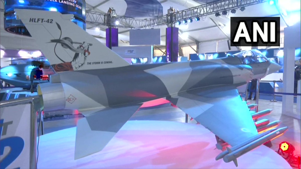 ANI's tweet photo. #AeroIndia2023 | Picture of Lord Hanuman once again displayed on the tail of HLFT-42 full-scale model of Hindustan Aeronautics Limited (HAL), showcased at the airshow in Bengaluru, Karnataka. https://t.co/PKQDEm54iC