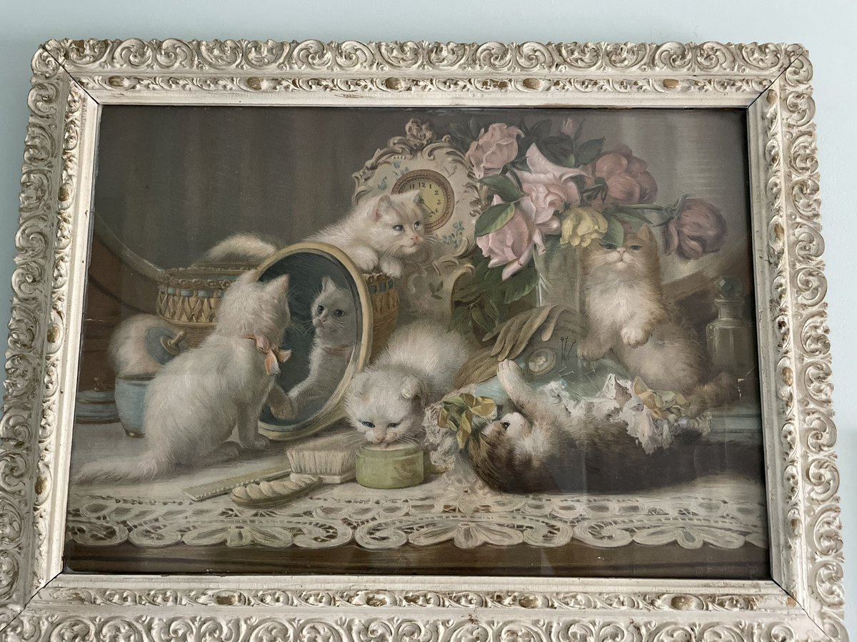 jack______smith's tweet photo. this is a painting about 5 kittens who've lost their mother figure and are playing with her scents and usual things, just beginning to consider what it means that she's gone. the circular composition - the mirror to clock to flowers to table to mirror again - makes it cyclical: https://t.co/xbBR80qhN8