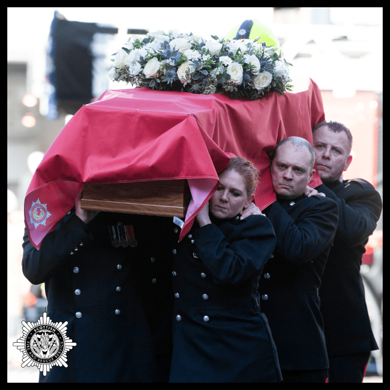 fire_scot's tweet photo. Barry was given a Guard of Honour by his colleagues from McDonald Road Community Fire Station. 

A minute’s silence was observed by guests and Barry’s fellow Blue Watch firefighters, who were the pallbearers, accompanied their colleague for one last time.