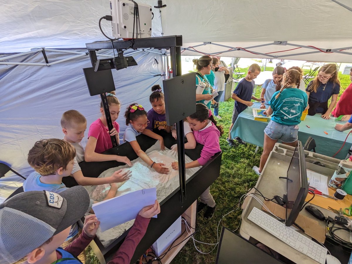 ComitUsf's tweet photo. We're thrilled to finally have the @StPeteSciFest back! The Friday school day is in full swing using our brand new AR Sandbox as well as tried and true Legos to build a 3D model of #TampaBay!! #scienceinthesun #stpetesciencefest https://t.co/klggdodE78