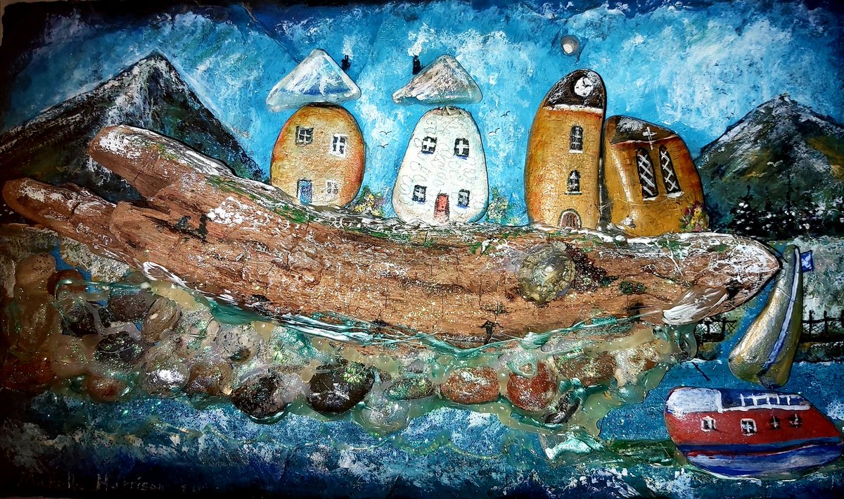 Michelle Harrison art work. It is  pebbles  Art . It is small pebbles and sea glass and driftwood on slate with Acrylic paint.