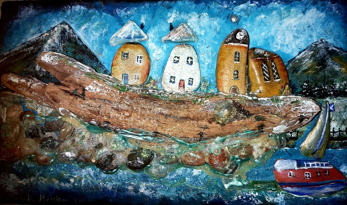 Michelle Harrison art work. It is pebbles Art . It is small pebbles and sea glass and driftwood on slate with Acrylic paint.