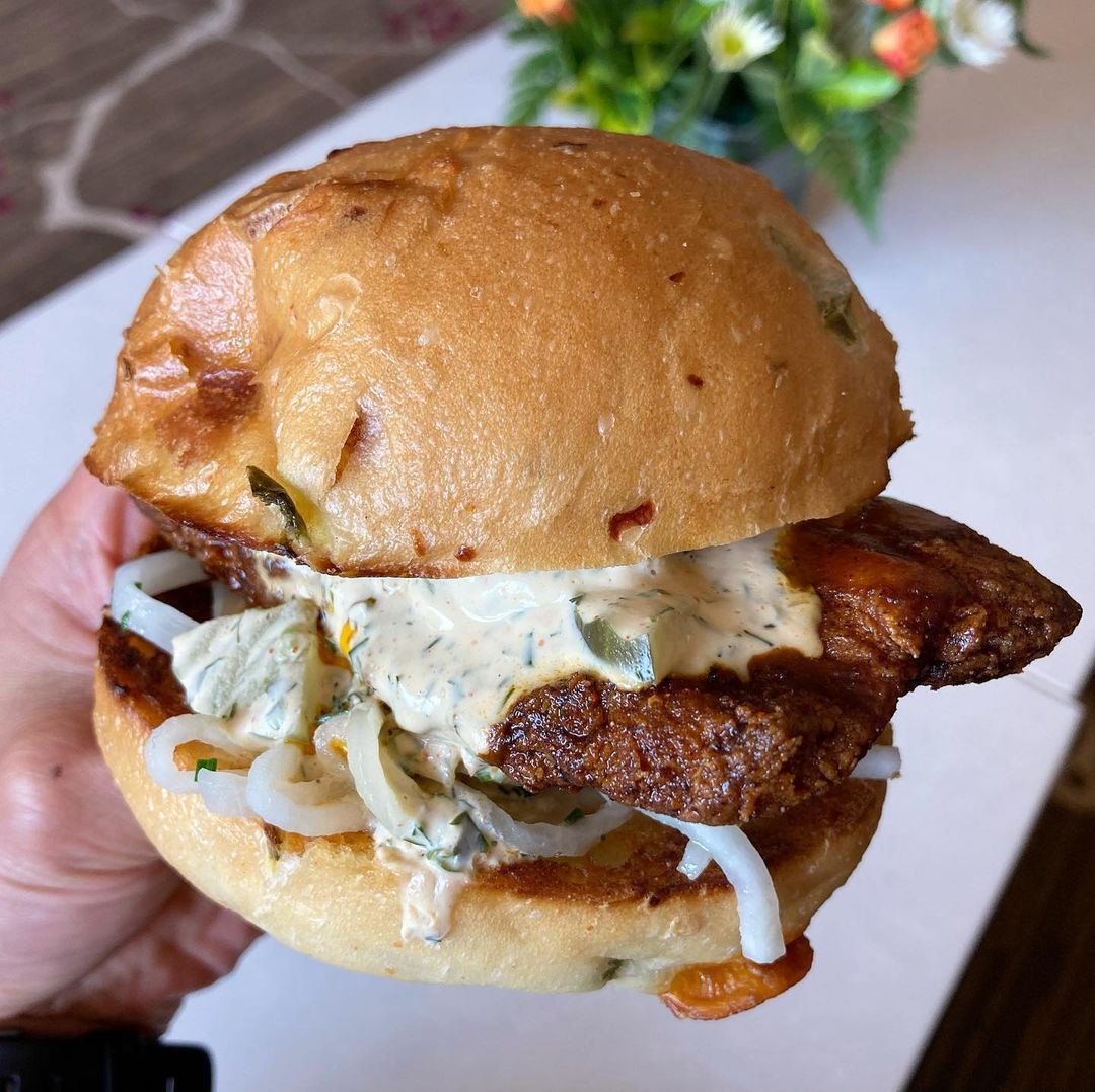 The Hot HOT Chicken Sandwich just hits different with the mitmita, butter poached daikon radish, and spicy yogurt dill pickle ranch. 🔥