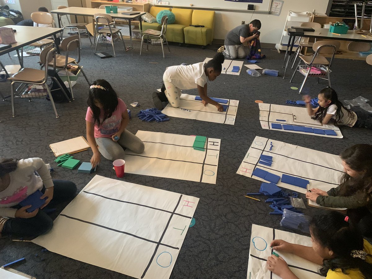 Let's Go H T O!! 2nd graders had a blast practicing addition and subtraction on their giant place value chart! #mathisfun #wilburnelementary #wearecrew @WilburnElem