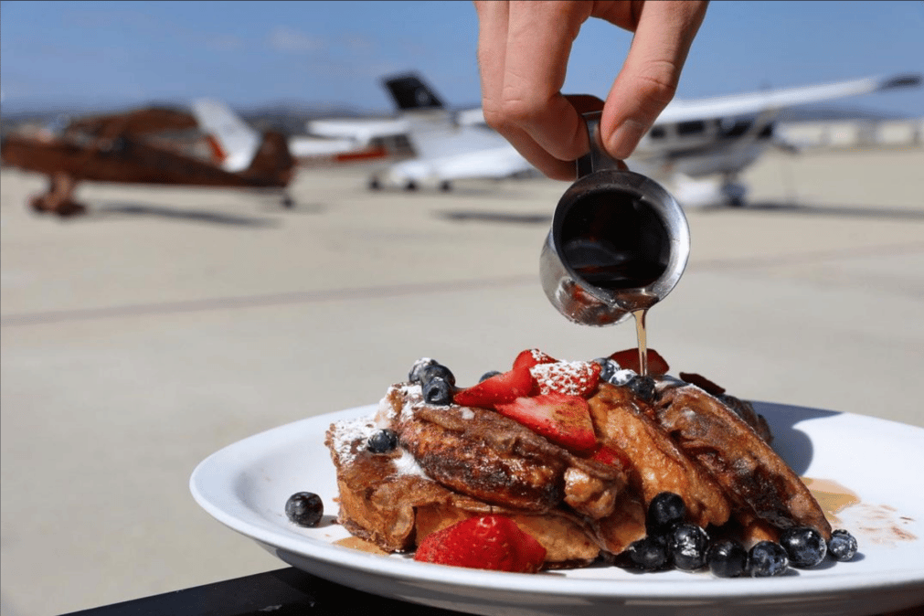 Brunch is unbelievable at Waypoint Cafe, and not just because of the delightful food!😋  

✈️ It’s one of the few places you can watch planes land and take off while sipping mimosas on the heated outdoor patio.