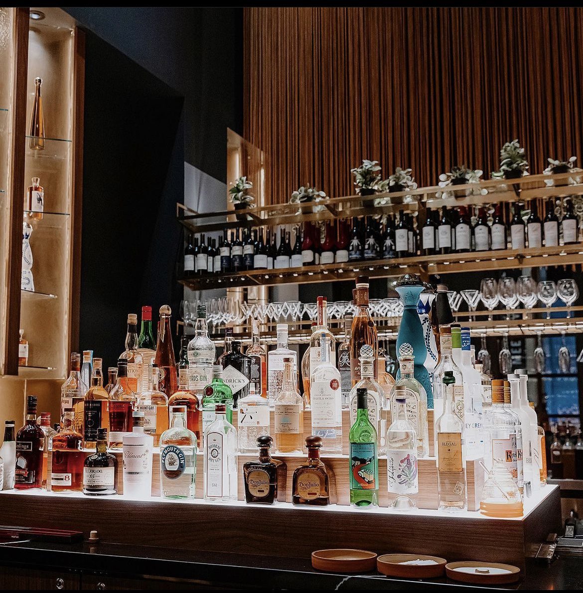 cazeyjonez's tweet photo. I love when the bar back in an airport bar is a work of art #Elways #denverairport https://t.co/aQzNRfGfpj