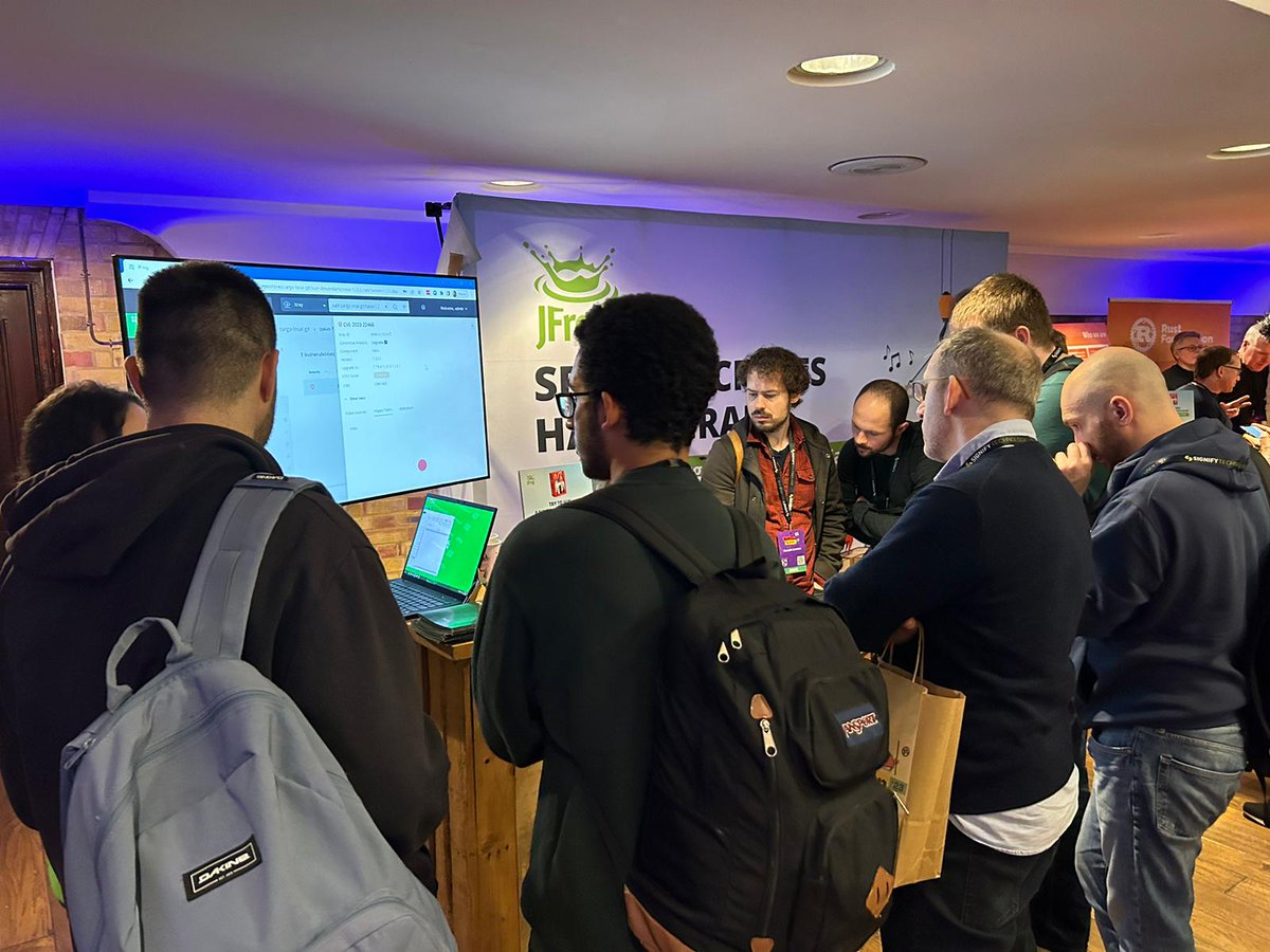 jfrog's tweet photo. What a day for the Frogs at @RustNationUK! We spy @steveonjava on stage! #rustlang #secureyourcargo 🐸🦀 https://t.co/yvJT6dML93