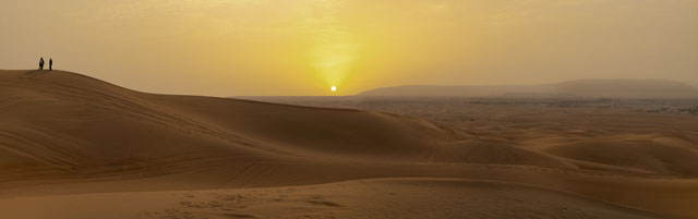 The #Arabian #desert at #sunset with #sun causing a #beautiful #colour cast and long #shadows over the #sand. This #panoramic #photography shows the #landscape of the #middleeast #UAE #Dubai, a popular #touristspot south of the #city #desertlife #Photography #sunsetphotography