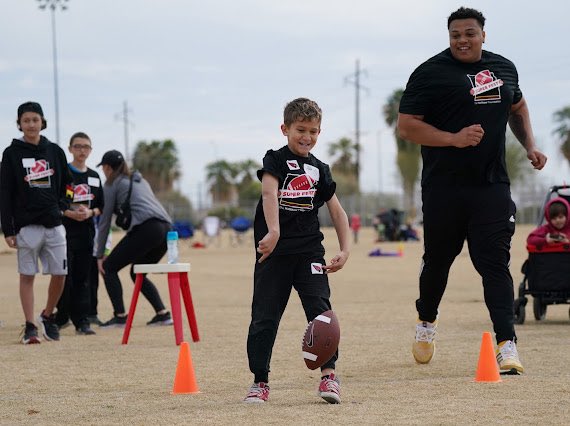 ASTATE_8's tweet photo. Being just a football player can never be enough…watching these young men change lives is what it’s about🔱 @ASUFootball #SunDevilsServe #SuperFest2023 https://t.co/zHgSc8GI0A