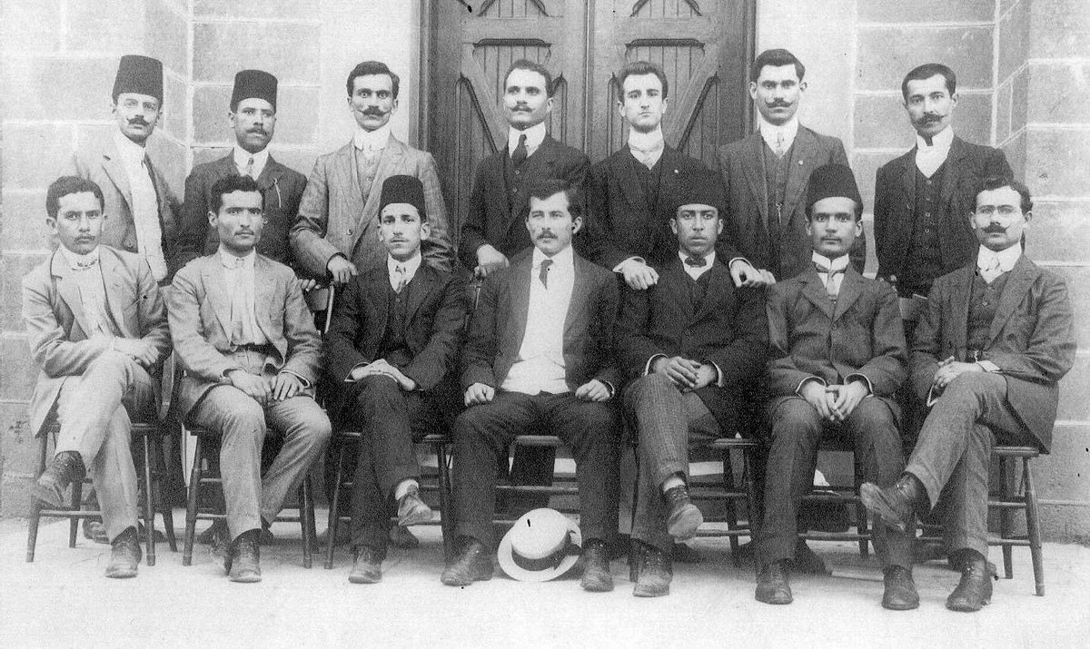 BogPoems's tweet photo. @dieworkwear reminds me of my great-grandfather’s graduation photo from pharmacy school in Beirut (he’s the one seated second front the left). somehow there are both fezes and a straw boater? https://t.co/uZYr3vLwJf