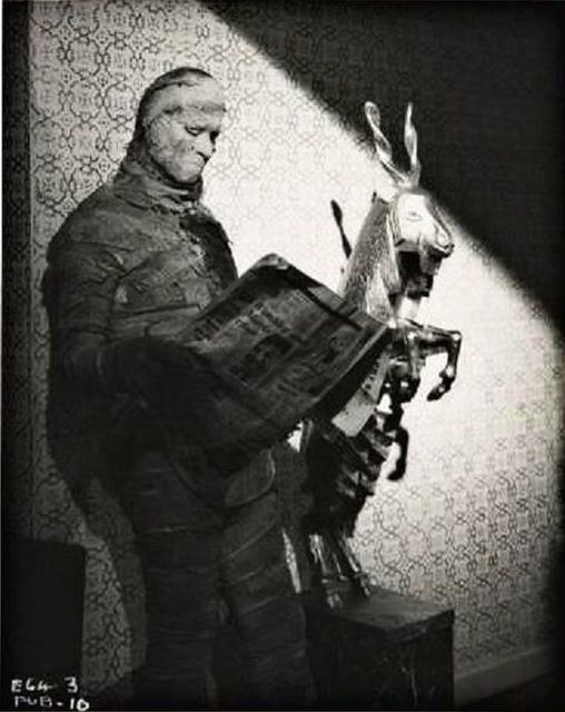 Dickie Owen catches up on the news whilst filming The Curse Of The Mummy's Tomb 1964