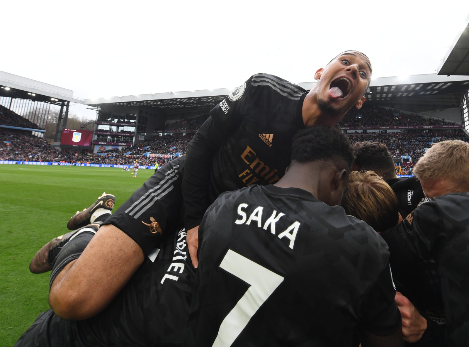 William Saliba and the team celebrate at full time