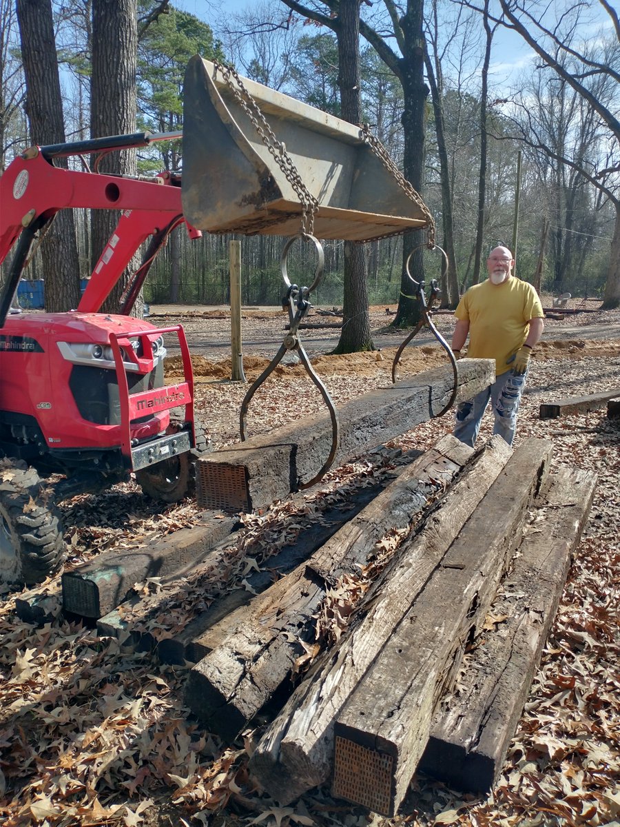 Here's some tongs I made so my co-workers (pictured) don't squash their fingers moving railroad ties. #rvparks #kineticsculpture #loglifters #functional #tractor