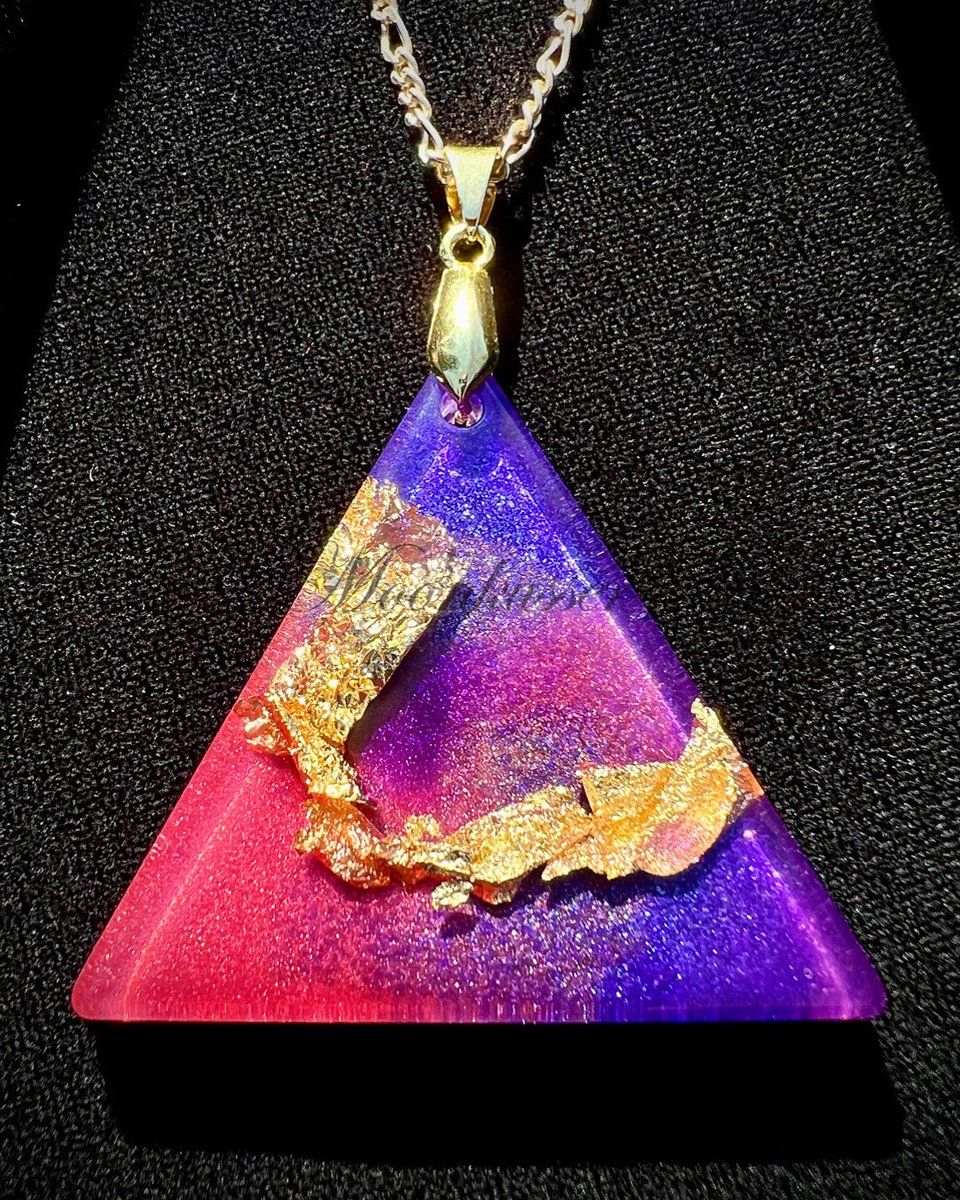 Triangle Resin Pendant. DM for info #moonkusserart #resinpendant #resin #jewelry #purple #pink #gold