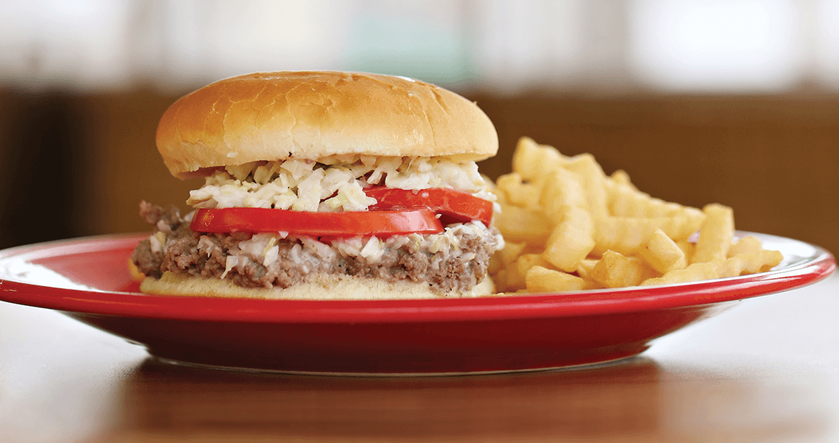 RegionalUSFood's tweet photo. Ground steak sandwich (Mount Airy/Surry County, NC) –– ground beef thickened with flour and water, served on a toasted, buttered bun, and topped with coleslaw, tomato, chopped onion, and mayo or mustard https://t.co/oY8D08nWR0
