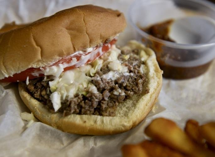 RegionalUSFood's tweet photo. Ground steak sandwich (Mount Airy/Surry County, NC) –– ground beef thickened with flour and water, served on a toasted, buttered bun, and topped with coleslaw, tomato, chopped onion, and mayo or mustard https://t.co/oY8D08nWR0