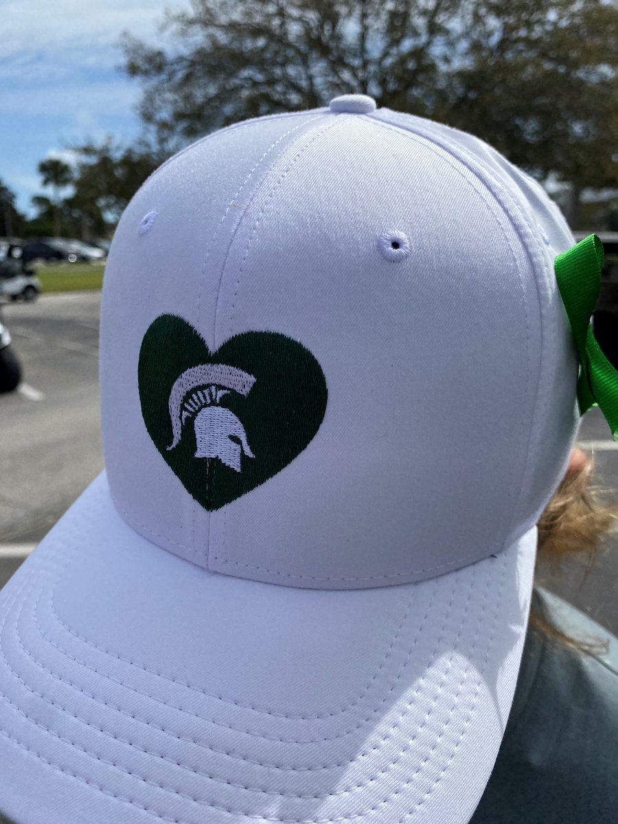 MSU_WGolf's tweet photo. Thank you @LouisvilleWGOLF for the green ribbons for each team at the Moon Golf Invitational and to @UMichWGolf for the hats their team wore today during our practice round. 

#SpartanStrong https://t.co/x4qgWQpK0p