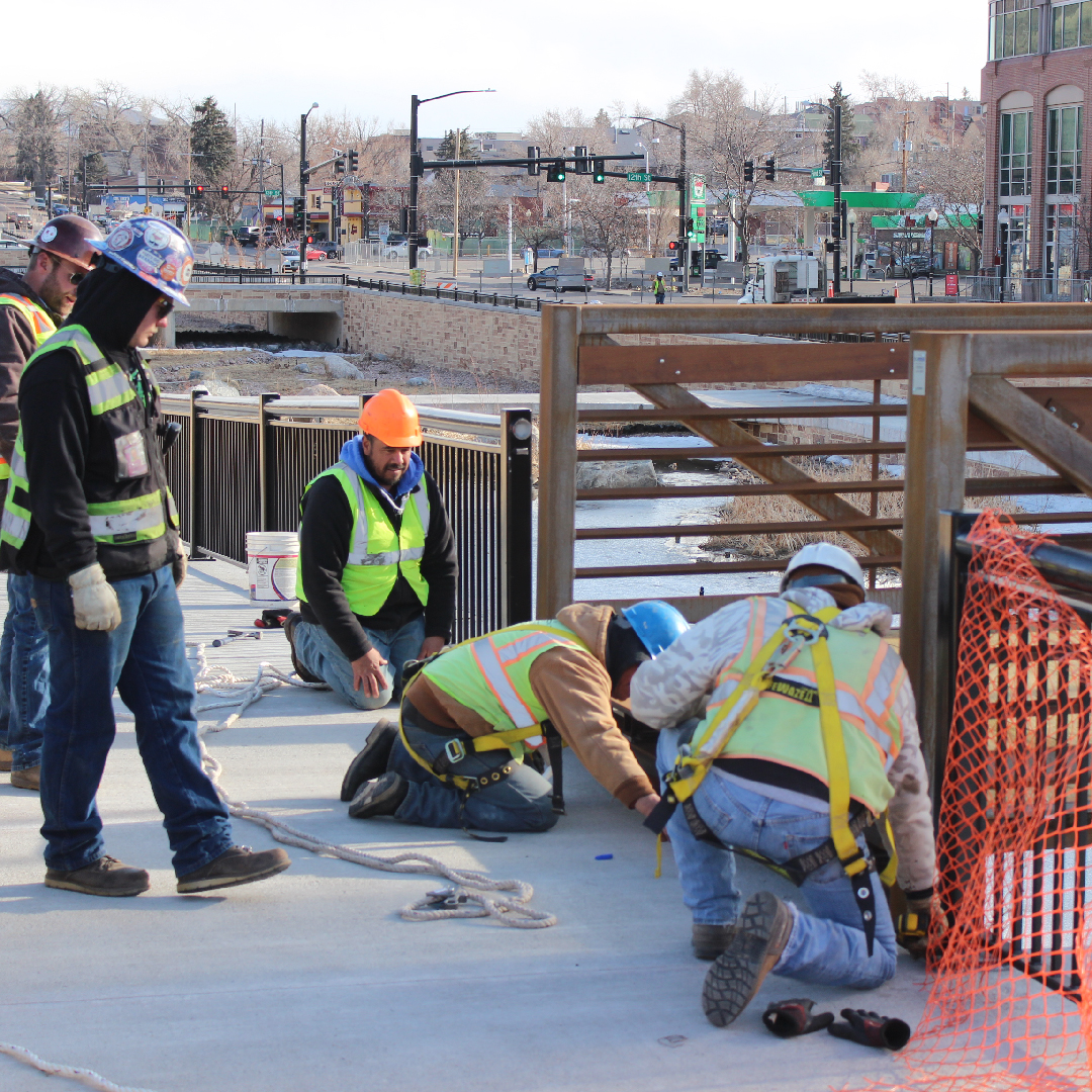 city workers installing bridge