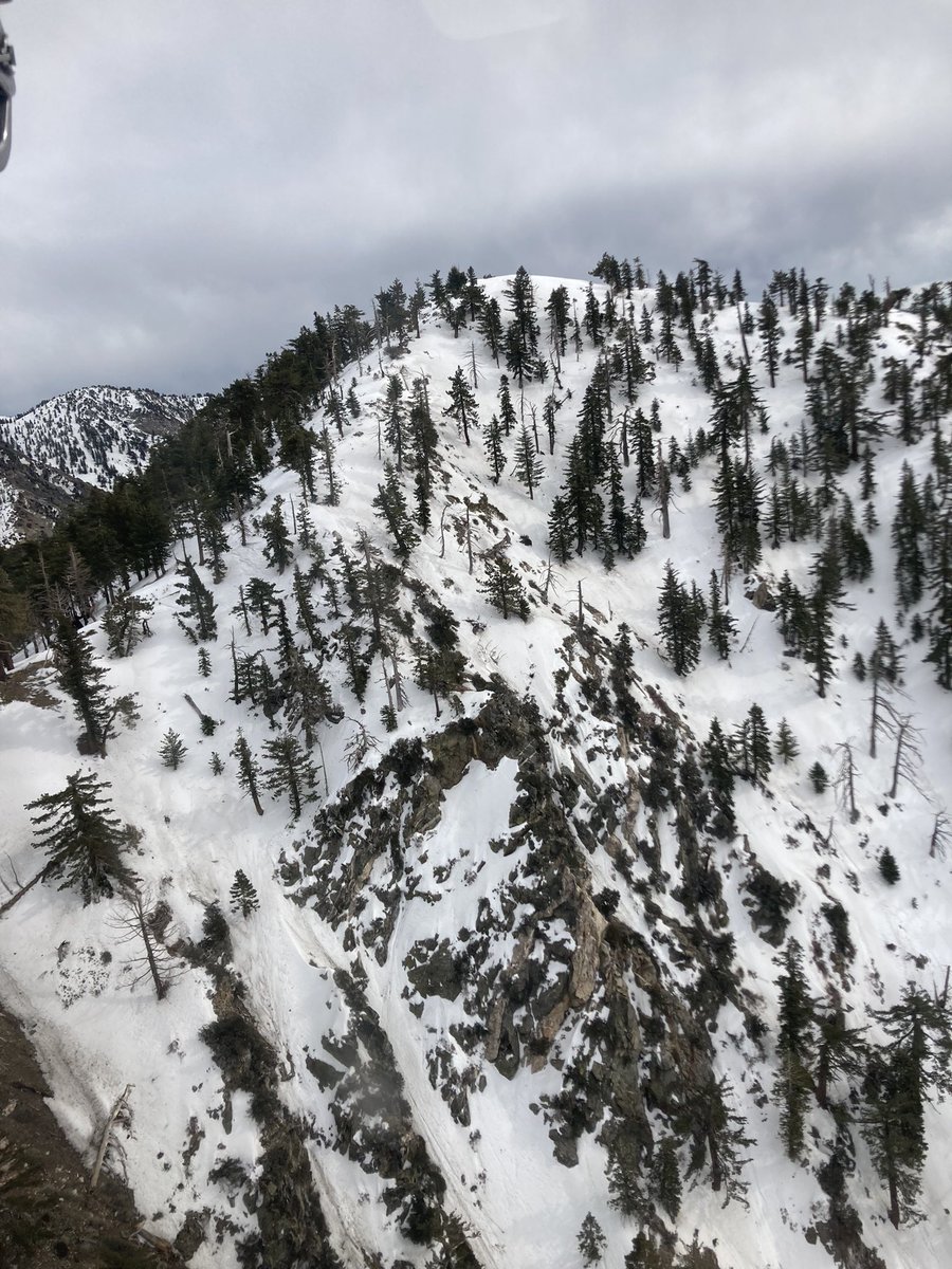 SEBLASD's tweet photo. 300’ below the summit of Mt Islip, Angeles Forest #LASD Air Rescue 5 inserted LASD SEB Tactical Medics and LASD SAR personnel to recover hiker in snow/ice. https://t.co/ZTT5PuXiae