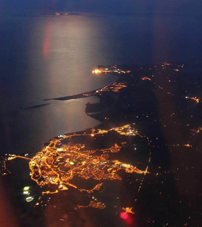 Awesome photo of #Wexford town at night taken from above by the Air Corps. You can see the lights from Wales visible in the distance.