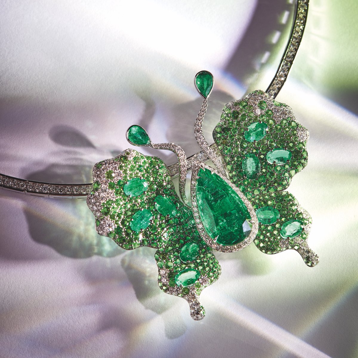 OfficialFaberge's tweet photo. The Fabergé x James Ganh Emerald Butterfly Necklace featured in MOJEH Magazine ✨ 
 
#Fabergé #MOJEH #ButterflyBrooch #ALifeInColour https://t.co/ma0VL1B6LE