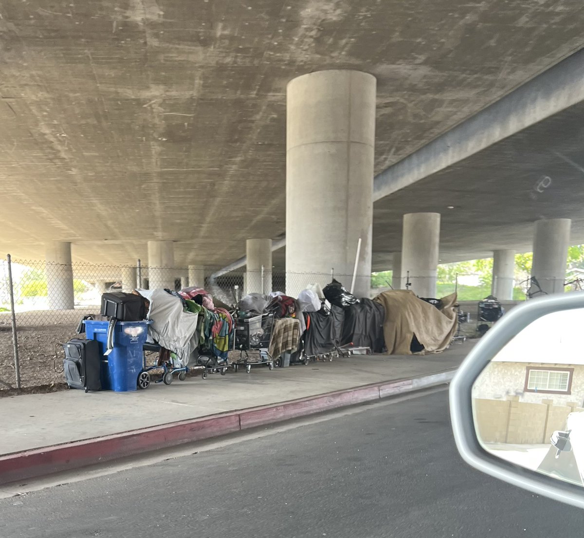 SuArmendariz's tweet photo. Please explain Municipal Code 41.18, which states no encampments 500ft from underpasses. Growing homeless encampment in a Granada Hills residential area for 4wks that has not been addressed. Homeless building fires, drug deals recorded. Our community is on lockdown. #newpandemic https://t.co/KN8mQelnL8