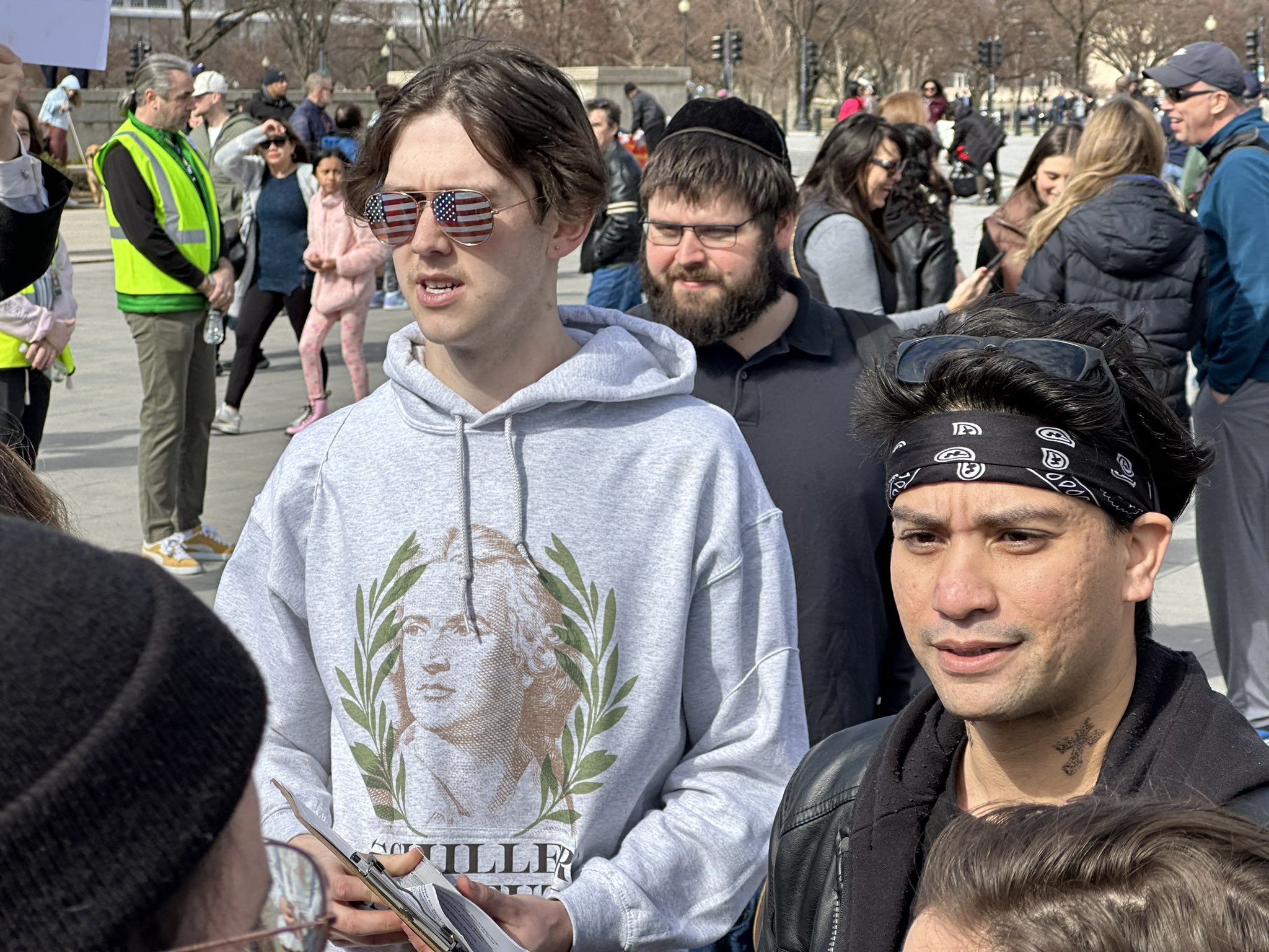 A protester holding a placard saying U.S. war machine: real threat to  peace at a rally against war with Russia sponsored by multiple groups  including CODEPINK: Women for Peace, Black Alliance for