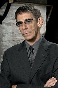 Respect to #RichardBelzer 
a.k.a. Detective John Munch.
Munch has become the only fictional character, played by a single actor, to physically appear on 10 different television series on 5 different networks:
