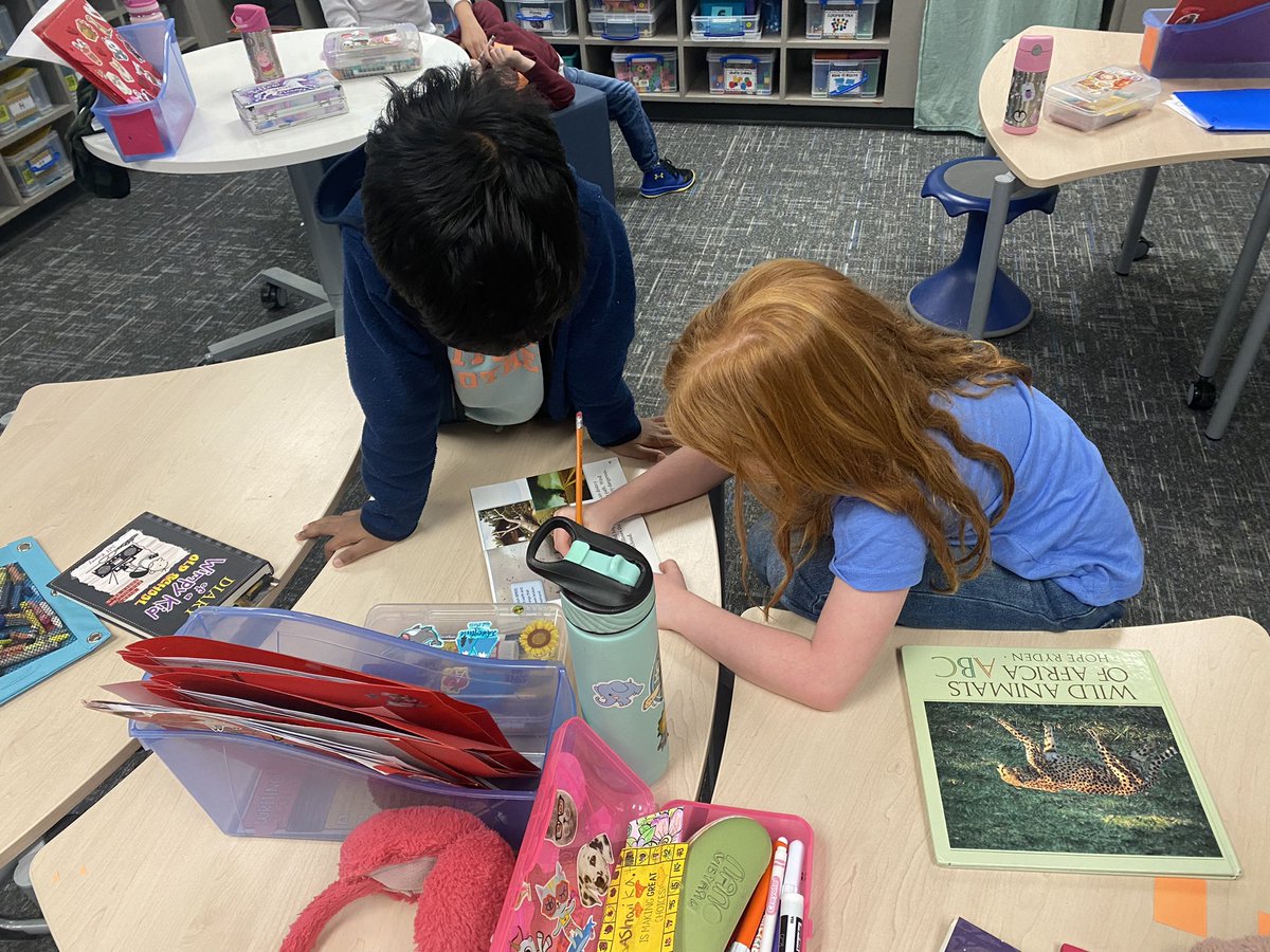MsWomack1st's tweet photo. Students discussing their “Think Marks” together in their books (parts that caught their eye). I love watching my kids collaborate and share out what they learned with each other! @SpearsElem #FISDmadetoshine https://t.co/o6uvOHxYJG