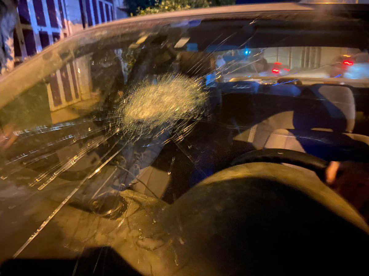 Israeli occupation forces fire gas bomb at a Palestinian car in the occupied West Bank city of Hebron, this evening.