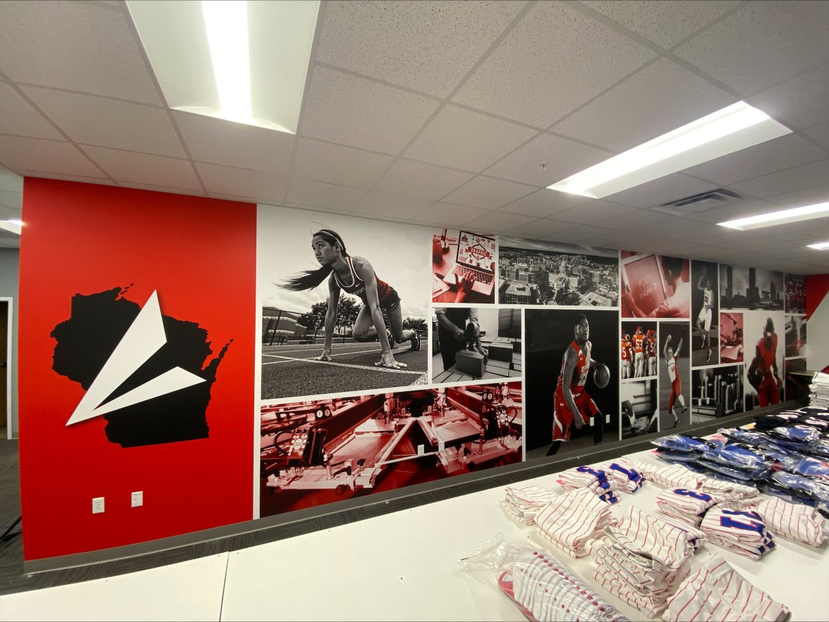 fanaktive's tweet photo. Our graphic artist Kaitlyn took some boring gray walls and brought them to life at the BSN Sports Waunakee office! 🤩 Contact us today to order your wall murals for your school or office! #fanaktivemarketing #wallmurals #largeformatprinting @BSNSPORTS https://t.co/EAkZMOxNe3