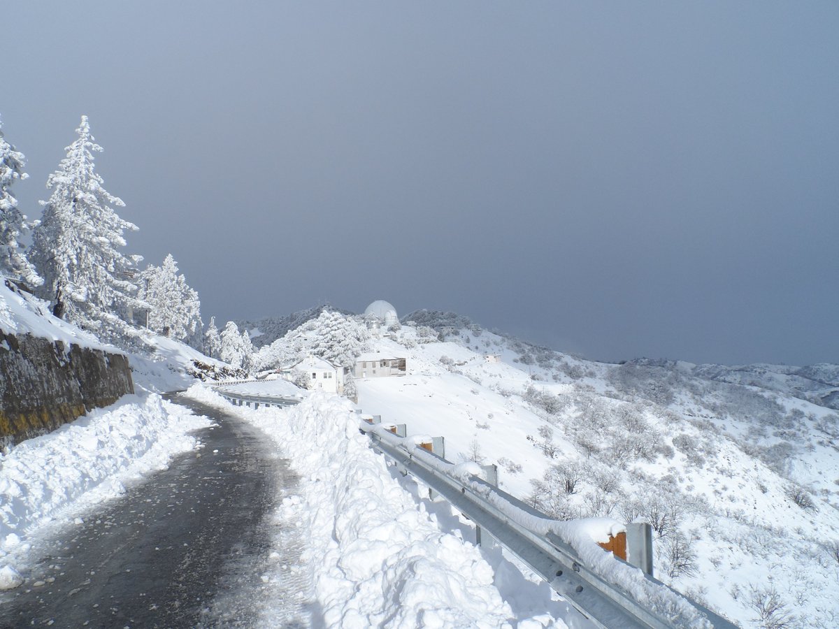 LickObservatory's tweet photo. The road up the mountain this morning is completely iced over and will remain closed as long as hazardous conditions remain. The @NWSBayArea just informed us that we should expect more snow fall starting in about an hour. That weather system may include hail, &amp; high winds. https://t.co/1dZV8rGNBF