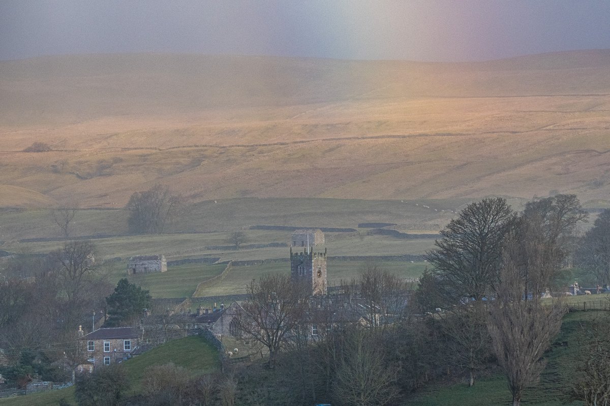 The lovely village of Askrigg, as a storm swept by and with a hint of a rainbow