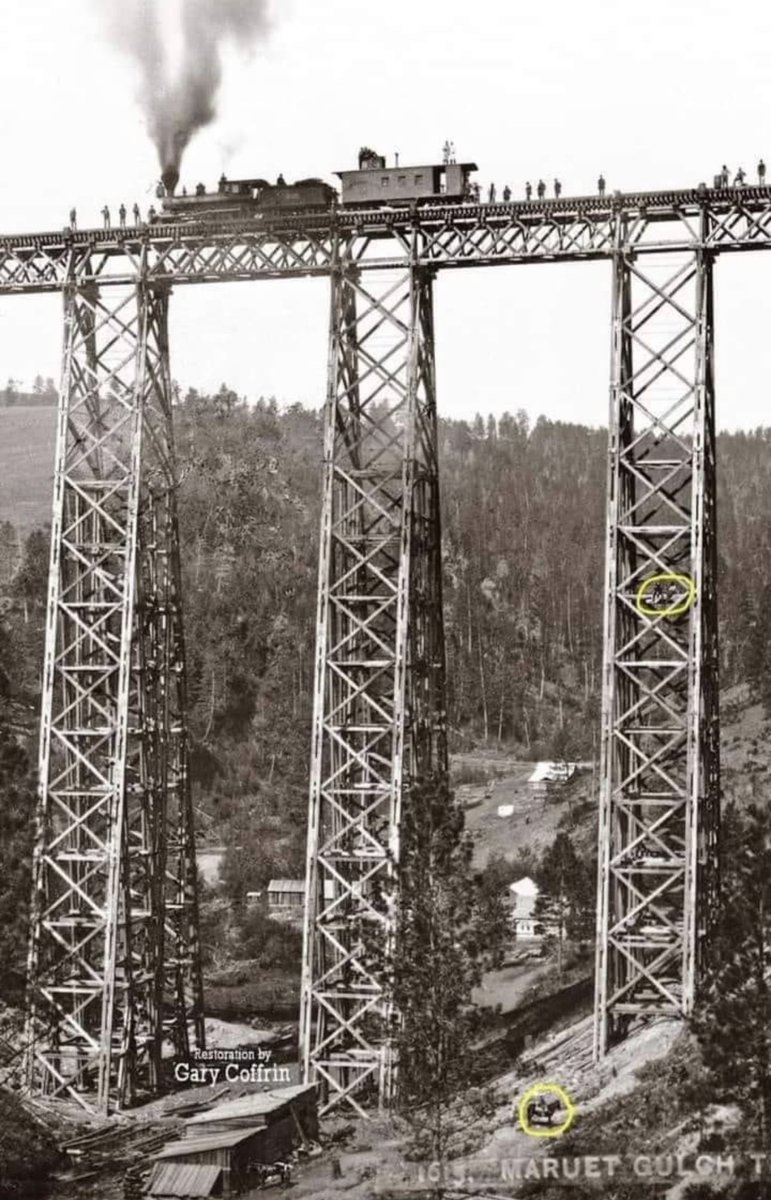 Northern Pacific Railroad workers stand next to a steam engine and car on the Marent Gulch trestle. This photo was taken in 1883, the year the trestle was built. The 226-feet-tall trestle is still used today.

Rail road workers would check the bridge weekly, up till 1970.