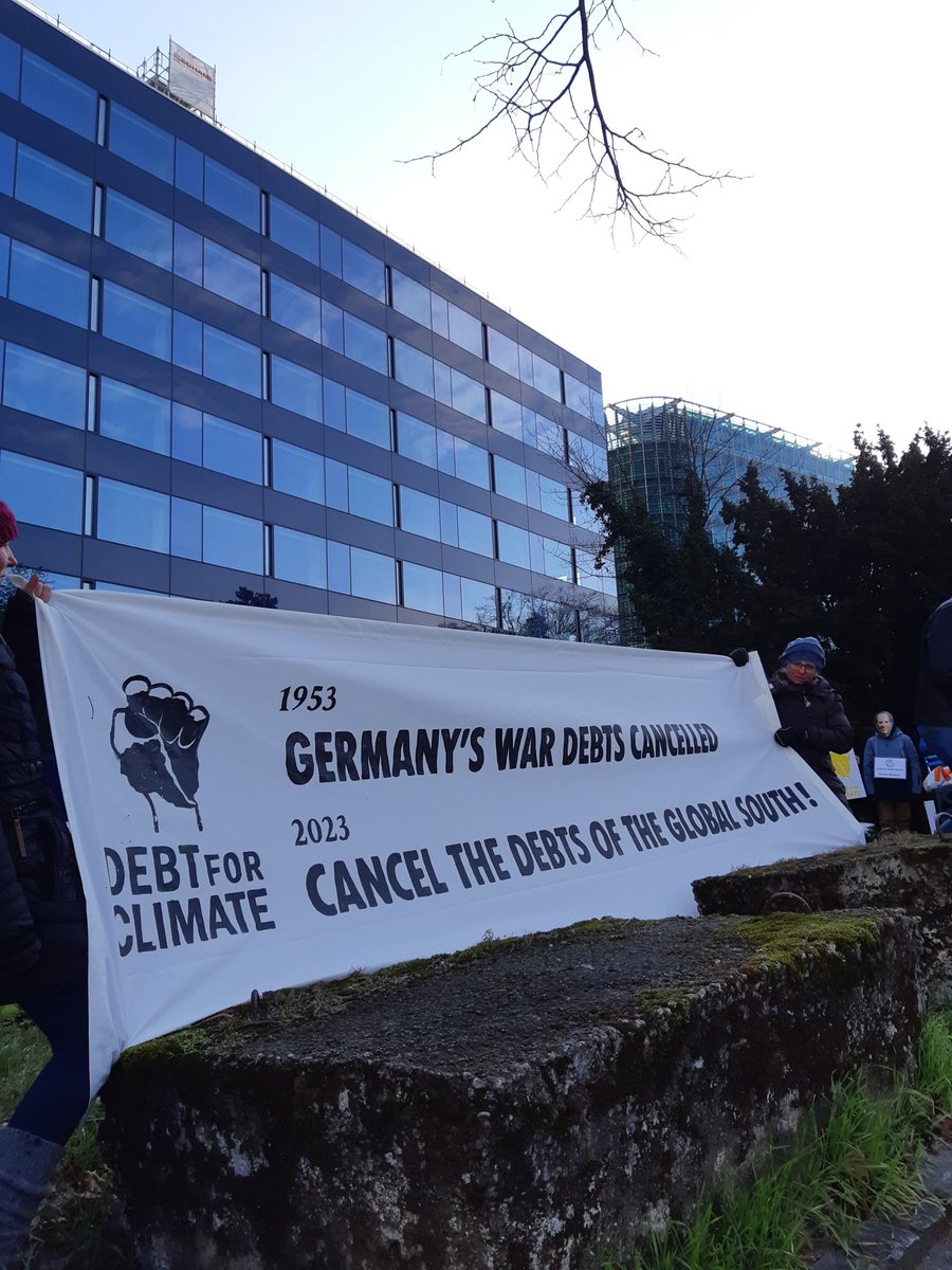 DebtforClimate's tweet photo. How does the debt trap work?

The @WorldBank and development banks have been promising for decades that debt enables poorer countries to get rich - in their terms - particularly by fueling the South's trade with the North.

📸 @Debt4ClimateCH protest at the worldbank in Geneva. https://t.co/sRFwQ2dB1L
