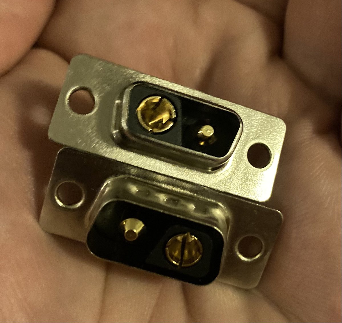 The DE-2 may look like a cursed connector but it’s actually really good.

Very positive mechanical polarisation of the connector. High current capacity (like an XT-60), low contact resistance.

Same old D-sub E footprint, backshells, locking screws, spacers and panel cutouts etc.