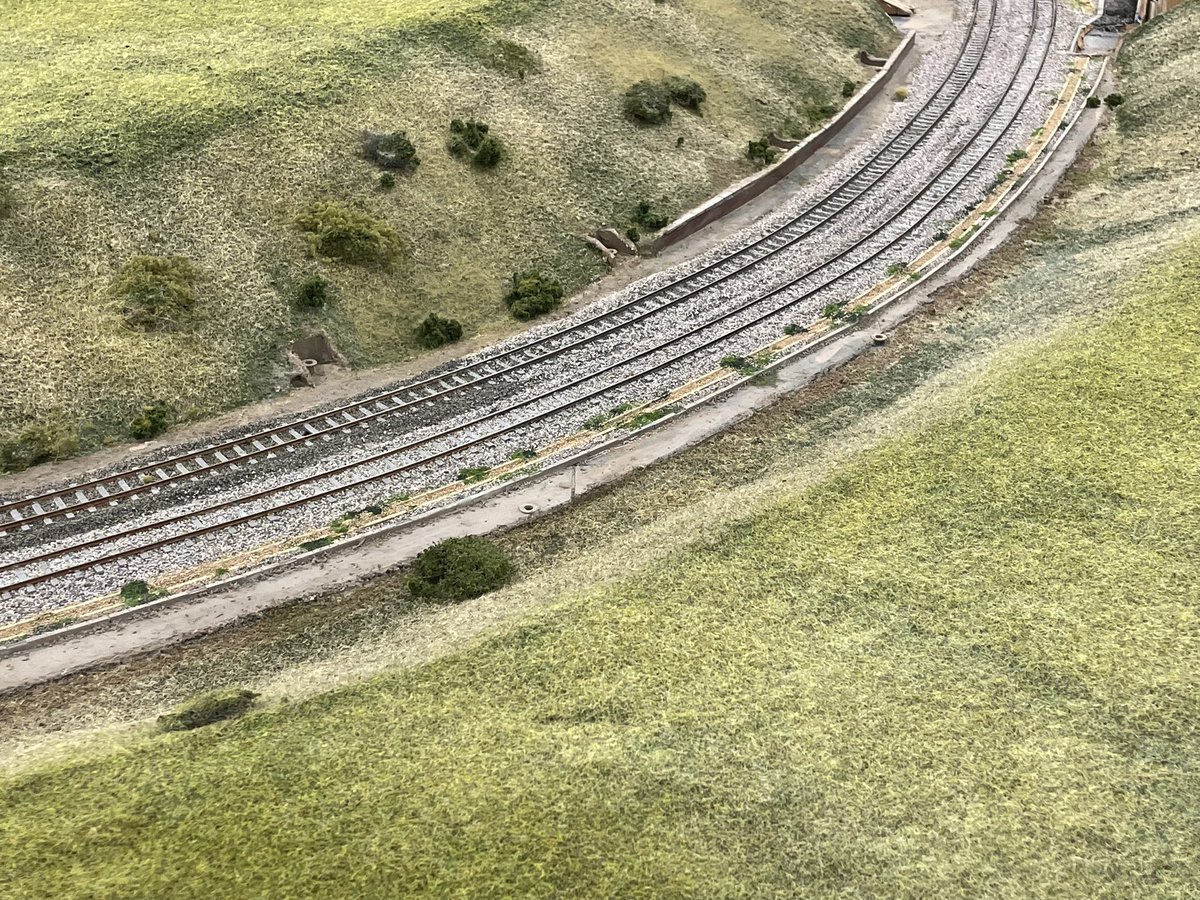 ModelRailClub's tweet photo. Amazing how quickly that changes the  look of a layout - a mix of static grass glue and the applicators (with PP3 batteries…) Ingatestone getting ready for #lfrom https://t.co/qJ6RVxfb53