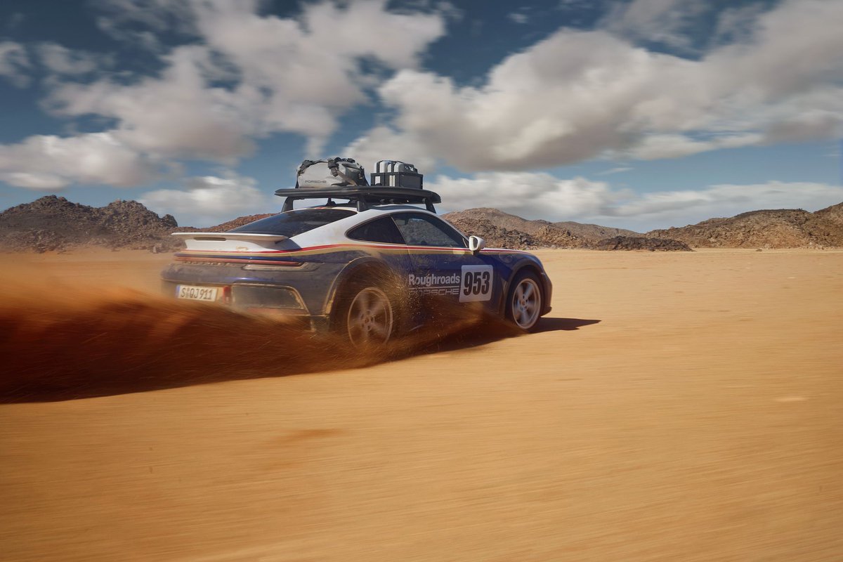 CARandDRIVER's tweet photo. The 2023 @Porsche 911 Dakar was almost called 'Safari' until it wasn't: https://t.co/Vxyyr1r8wN https://t.co/lMCnHki8X2