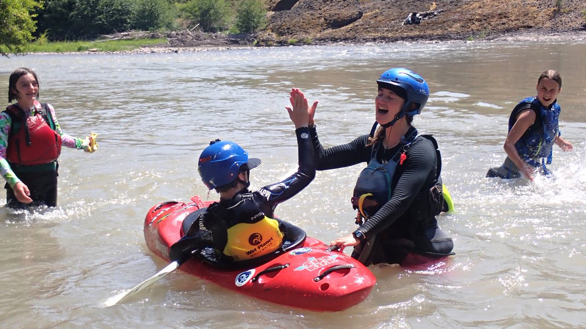 Celebrating after a kiddo crushes their first roll in Kids Kayaking Camp 🎉