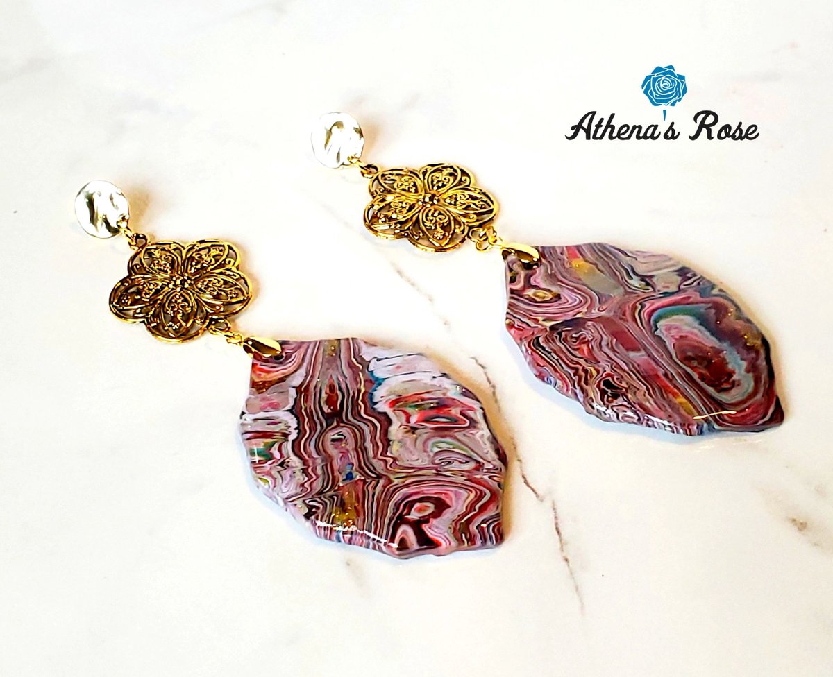 Spotlight of the Day: Gaia Earrings 
Interesting #abstractart shapes in the design create an image of a beautiful #earth creating a beautiful conversation piece. 
#polymerclay #Jewelryfashion #uniquejewelry #polymerclayearrings #clayearrings #shopsmall #Athenajewelry