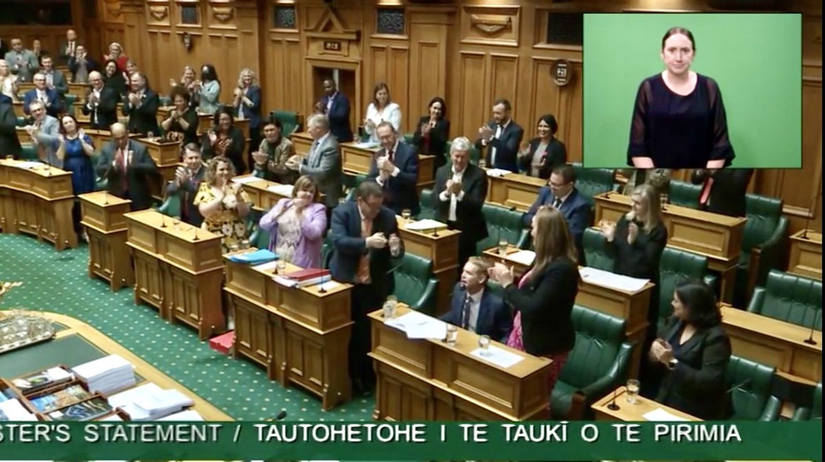 MarjaLubeck's tweet photo. Standing ovation for @chrishipkins first Prime Minister’s statement @NZParliament Talking about our focus on the bread and butter issues in front of New Zealanders right now, the cost of living and recovering and rebuilding from the cyclone. The recovery will [1/2] https://t.co/134nwDfxJP