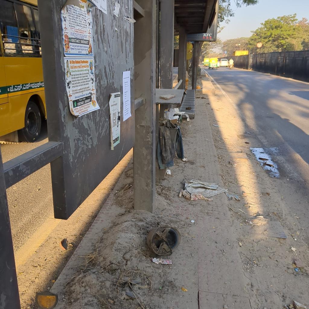 RajavelMano's tweet photo. @FriendsofBMTC Road "cleaned" and trash dumped in 4 feet wide bus stop https://t.co/80QyWSOEBd