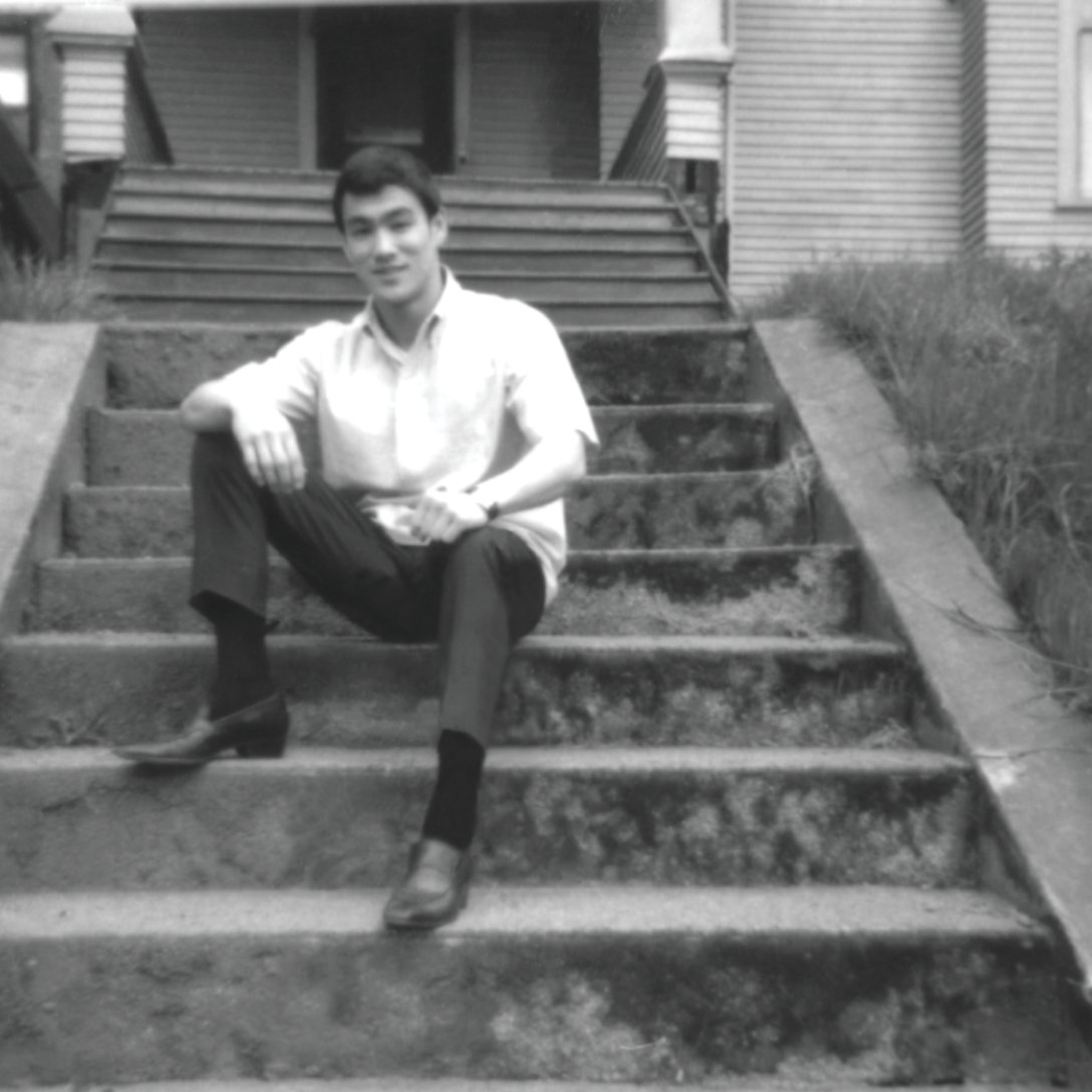 Bruce sitting on the steps in front of Linda's home in Seattle in 1964.
