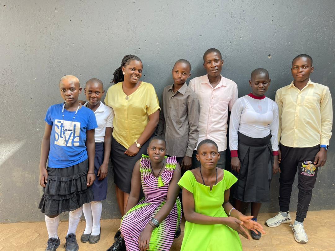 The young woman (In yellow) <a href="/Milly_nassolo/">Milly Nassolo Kikomeko</a> has been educating these kids for the last 7yrs, Today she chose to further their education . The kids are neither her siblings nor her tribemates but she finds peace in elevating others. This is the Uganda i want.