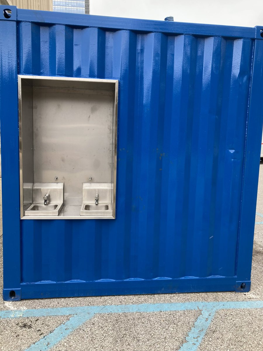 IndyOPHS's tweet photo. Downtown neighbors, both sheltered and unsheltered, can now take advantage of the new public restrooms at our Safe Distribution site, Old City Hall.  Painted Indy blue, these restrooms feature hand washing stations, plus 5min timed-locks and purple light. https://t.co/G02x5OkVE4