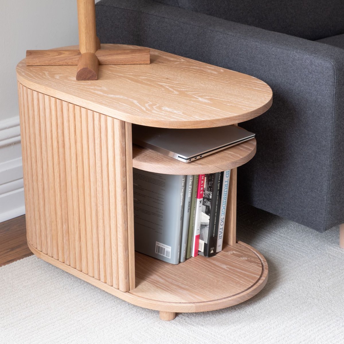 SolarFurniture's tweet photo. New: white oak end table with wraparound tambour door. Just enough practical storage space inside, especially with the built-in cable access.

28"L x 16"W x 20"H but adaptable to other sizes and shapes.
#customfurniture #furniture #furnituredesign https://t.co/QsFxaS7QN0