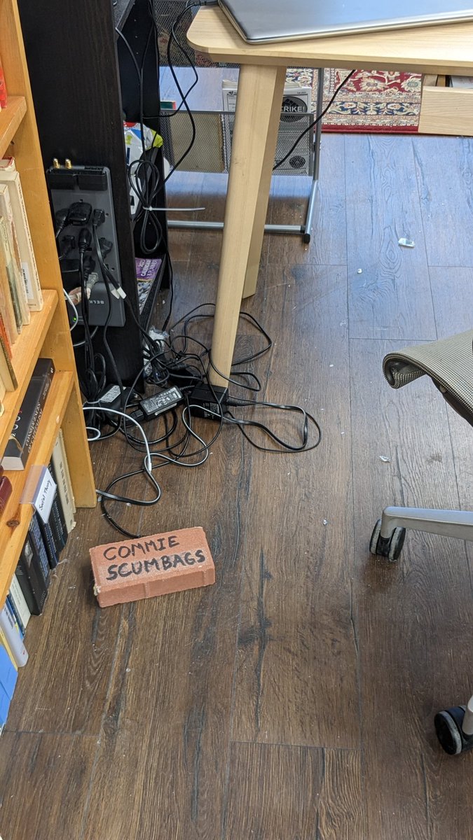 RedInkPVD's tweet image. HATRED STRIKES AGAIN! Last night an anti-communist message was sent to us in anticipation of our Red Books Day celebration of the publication of the Communist Manifesto. Last year they showed up with flags to intimidate, this year they threw bricks through the window.